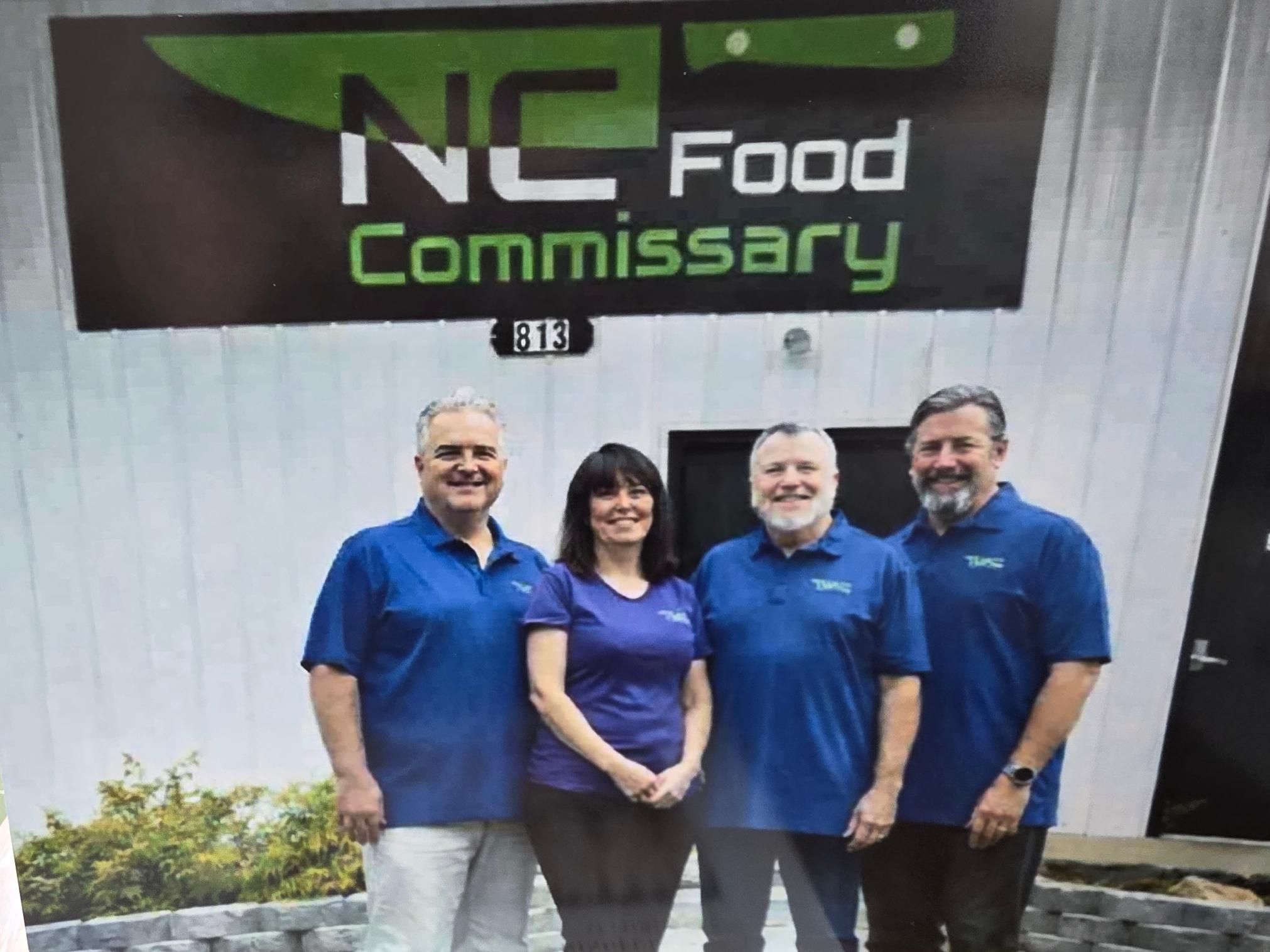 The NC Food Commissary leadership team outside the building