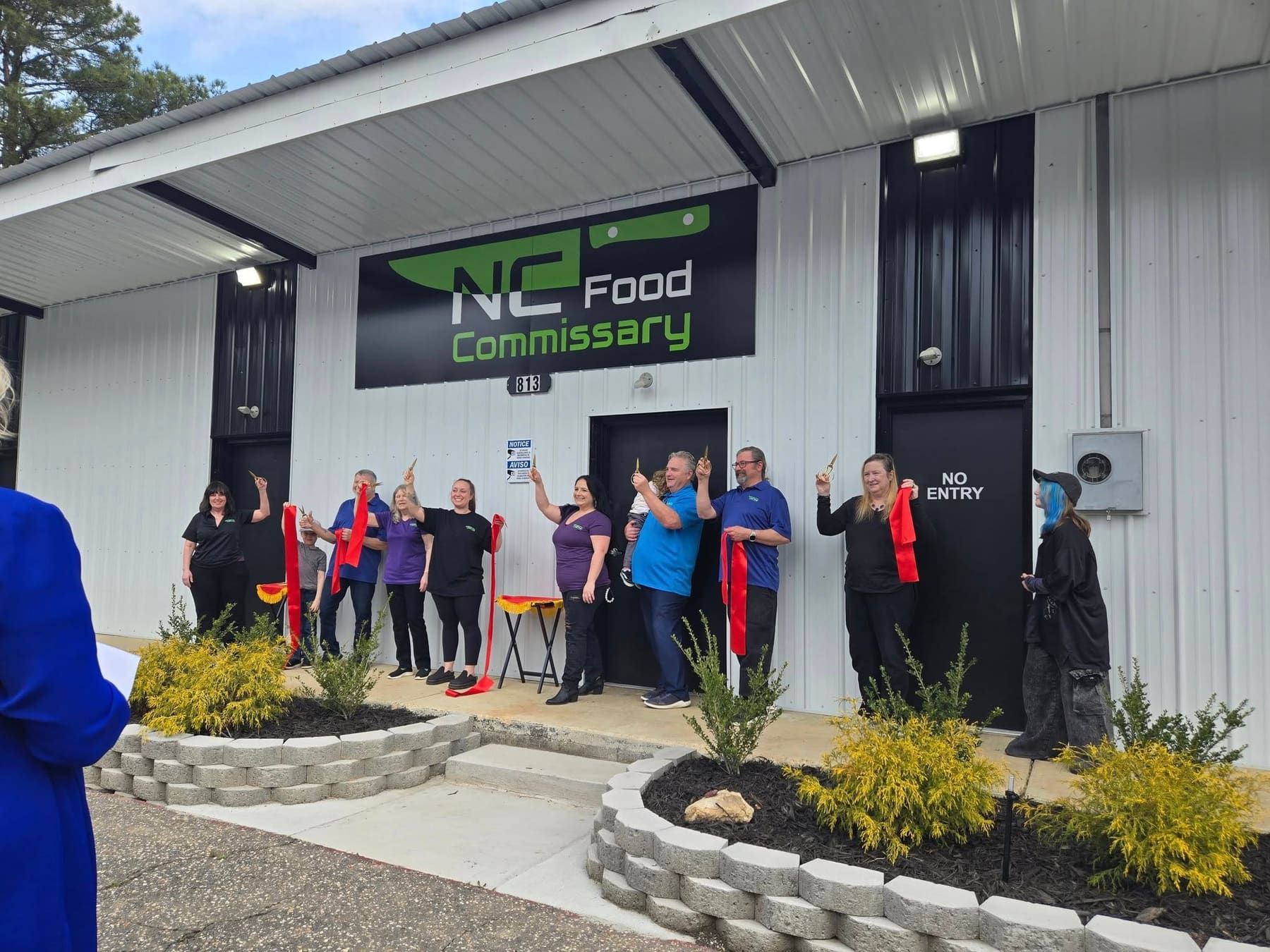 The finished front wall under the NC Food Commissary sign on opening day