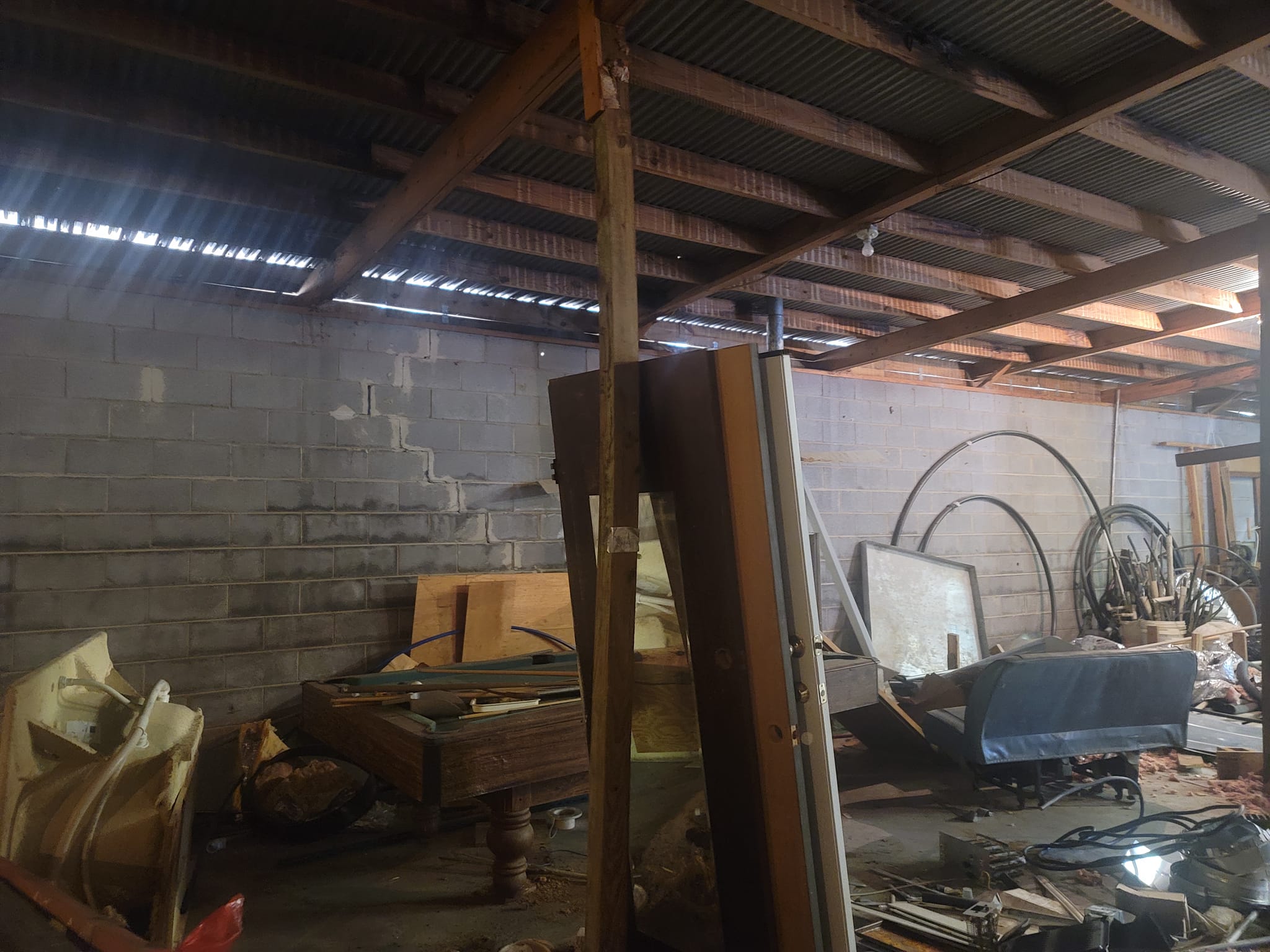 Unused warehouse space stacked with leftover material